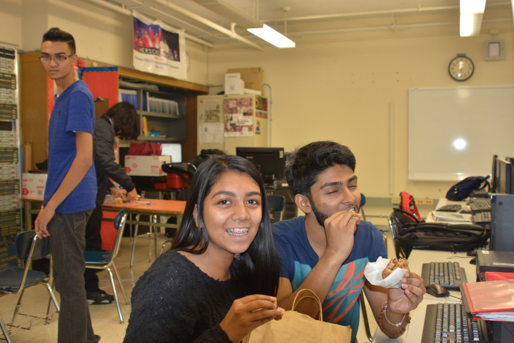 Seniors, Syeda Ahmed and Shiv Lal trying Levain Bakery’s signature chocolate chip walnut cookie!