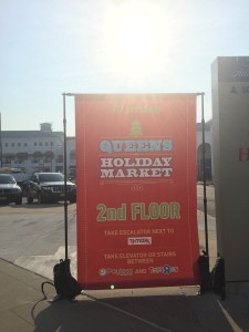 Billboards are seen trying to guide and attract people to attend the holiday market.