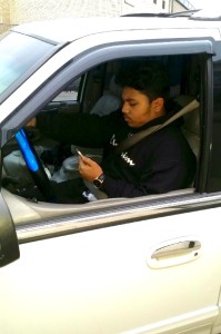 Brandon Surujbali demonstrates distracted driving. Photo Credit: Vernon Surujbali