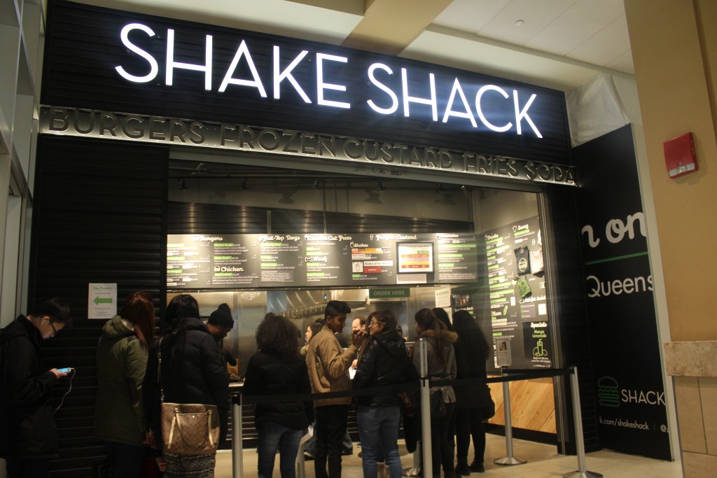 The Shake Shack chain at Queens Center Mall located on the first level with entrances from 59th avenue and inside the mall itself. 