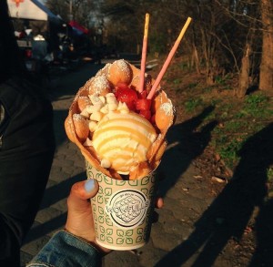 The original "Gai Dan Jai" egg waffles with ice cream topped with fresh strawberries and strawberry Pocky.