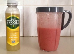 Naked Pressed pineapple juice next to a homemade banana and strawberry smoothie. 