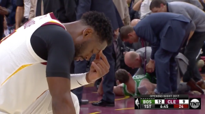 Dwyanye Wade, praying for Gordon Hayward’s after his injury. Photo by Daniel Rapaport​