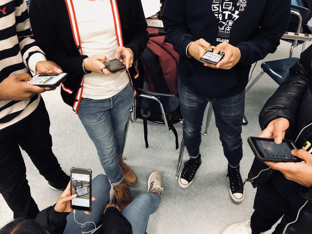 Caption: This photo shows a group of friends who are too interested with their phones to actually hang out and converse among each other. 
Picture Credit: Rachel Rasul