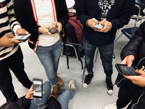 Caption: This photo shows a group of friends who are too interested with their phones to actually hang out and converse among each other. Picture Credit: Rachel Rasul