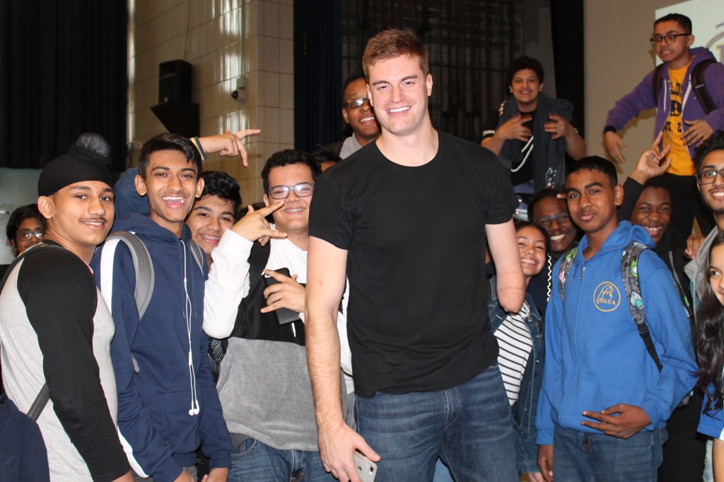 Kevin Laue posing for a picture with Edison students who wanted to have personal conversations with him after motivational speech. 
Credit: Nahomi Vindell