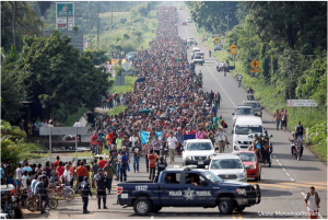 Central American migrants walk along the highway near the border with Guatemala, as they continue their journey trying to reach the U.S., in Tapachula, Mexico Oct. 21, 2018