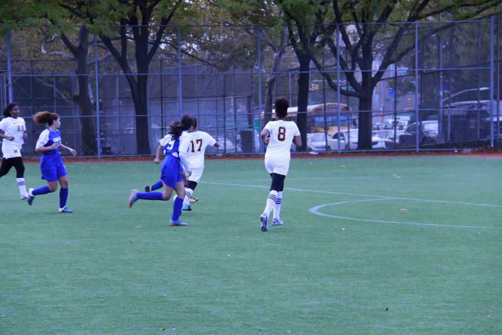 Caption: Edison's girls soccer team playing in a final match.
Credit: Esdras Louis