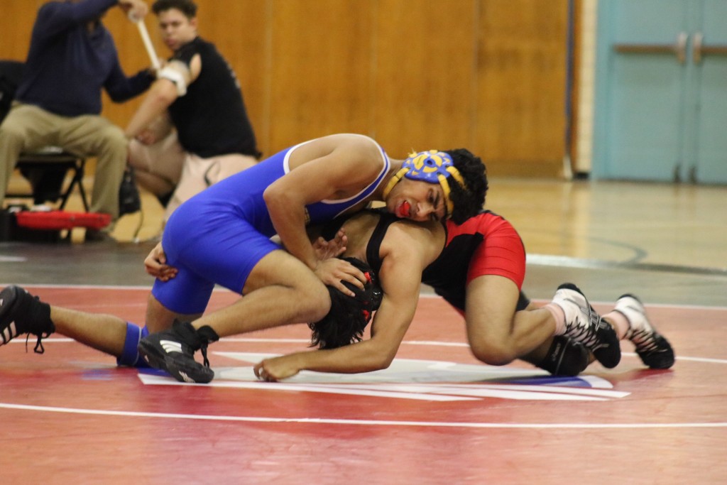 Edison’s wrestling boys varsity and Coach Castillo celebrate their victory and have a record of 6-1 this season.