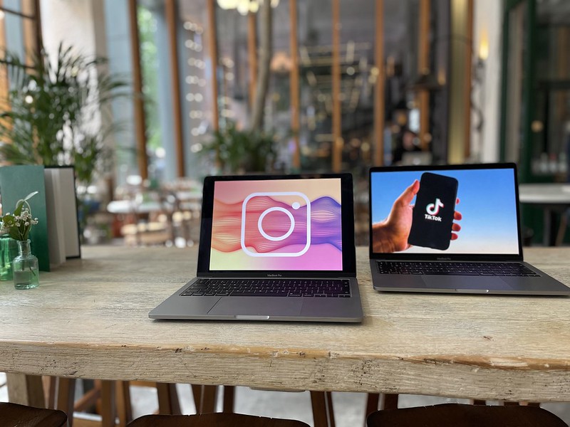 "Instagram and TikTok logos displayed on a laptop" by curemedia is licensed under CC BY 2.0.