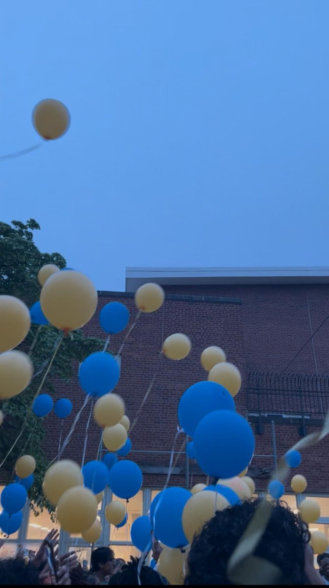 Students releasing their biodegradable into the air at the climax of the senior sunset event