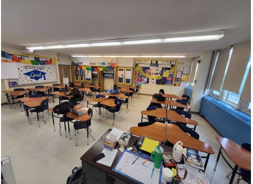 Nine desks a separated to the right of the classroom to show how much space will be opened up by 2028 school year 
