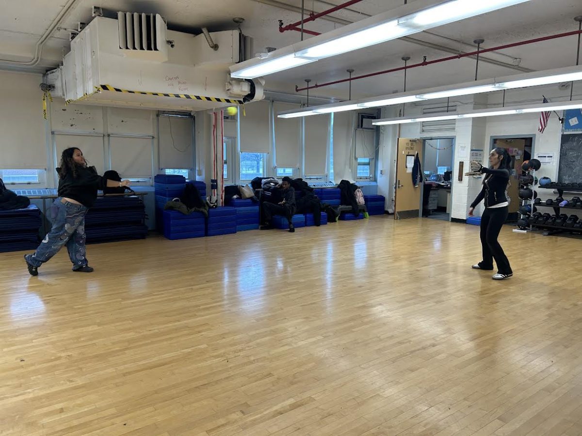 Girls Softball Club uses the dance studio to work on their fielding while the field is covered in snow.