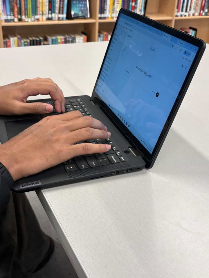 Student using ChatGPT on a laptop.  