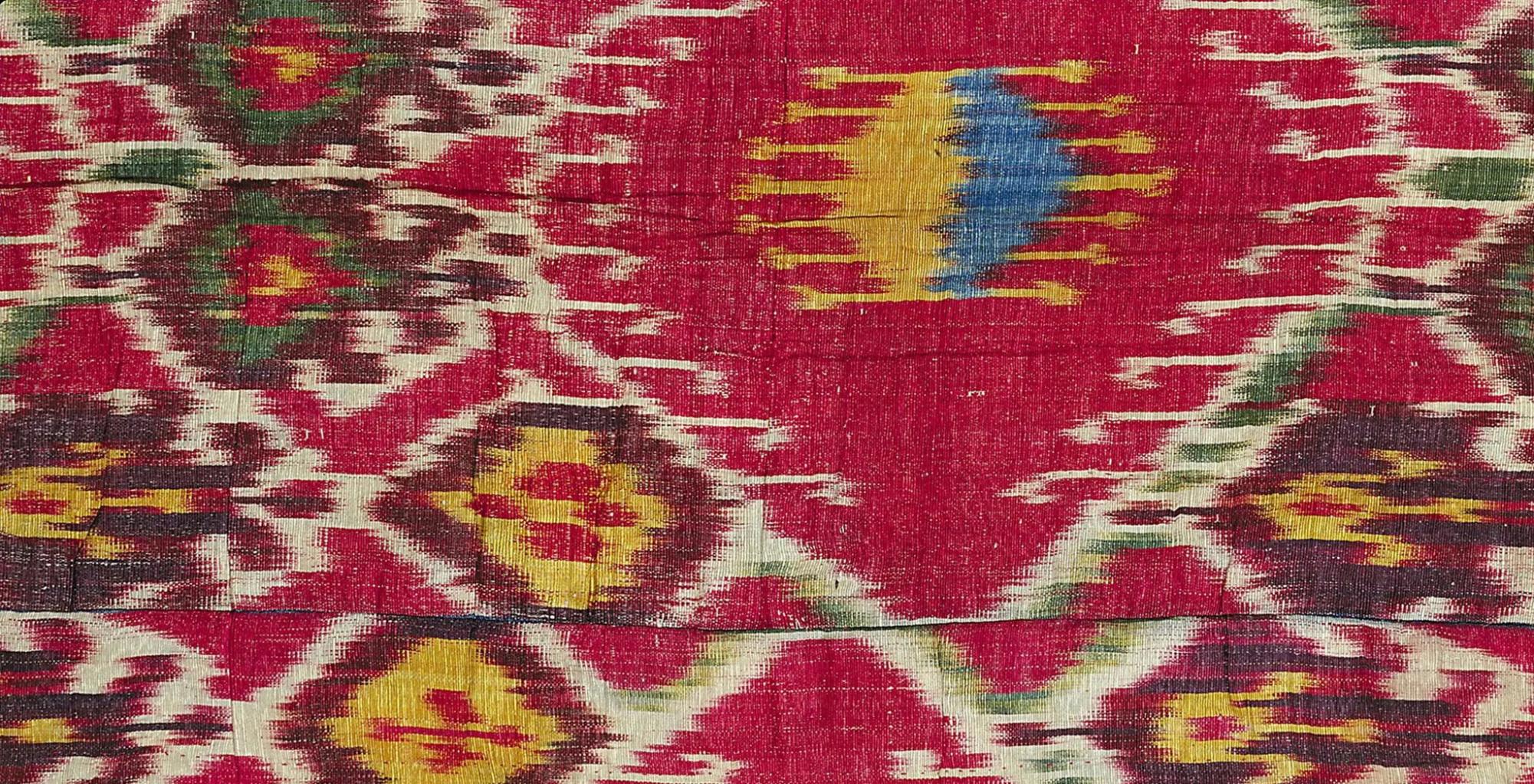 The arrangement of the unbound threads on the loom blends neighboring colors together, creating the signature soft, slightly blurred effect of these textiles. This is evident in these 19th-century Uzbek panels woven from silk and cotton.