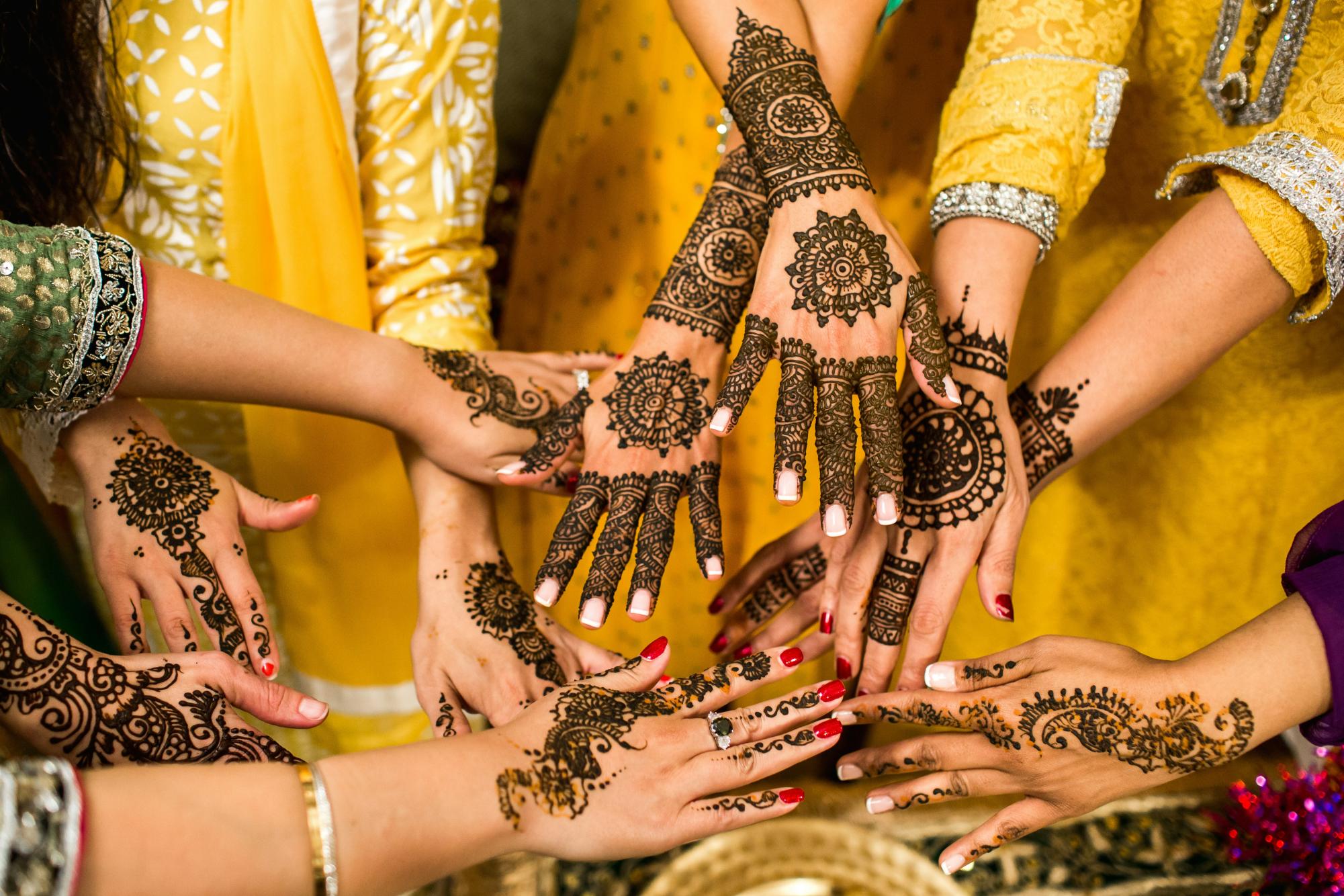 Henna-adorned hands, a traditional form of body art with deep cultural and historical roots, raise important questions about appreciation versus appropriation in modern contexts.