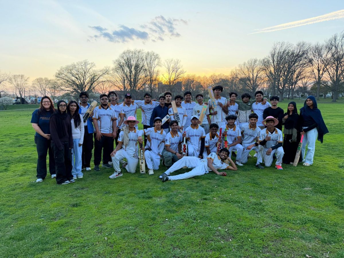 Edison cricket team coaches and managers together after a strong start.