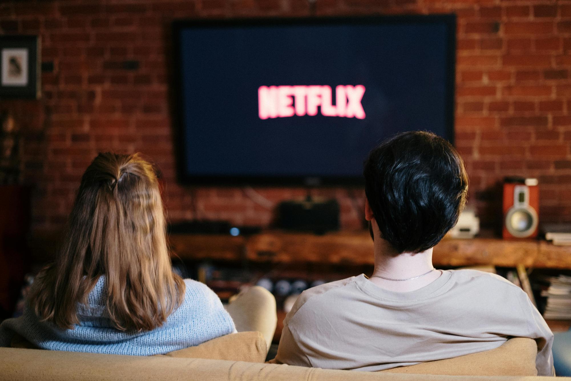 Family having a relaxing day watching Netflix in the living room. 
