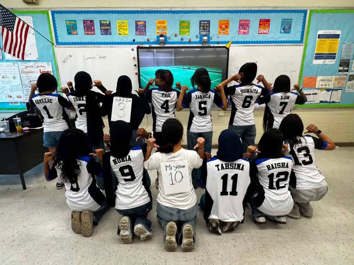 Members of the Badminton team pose for a jersey picture.