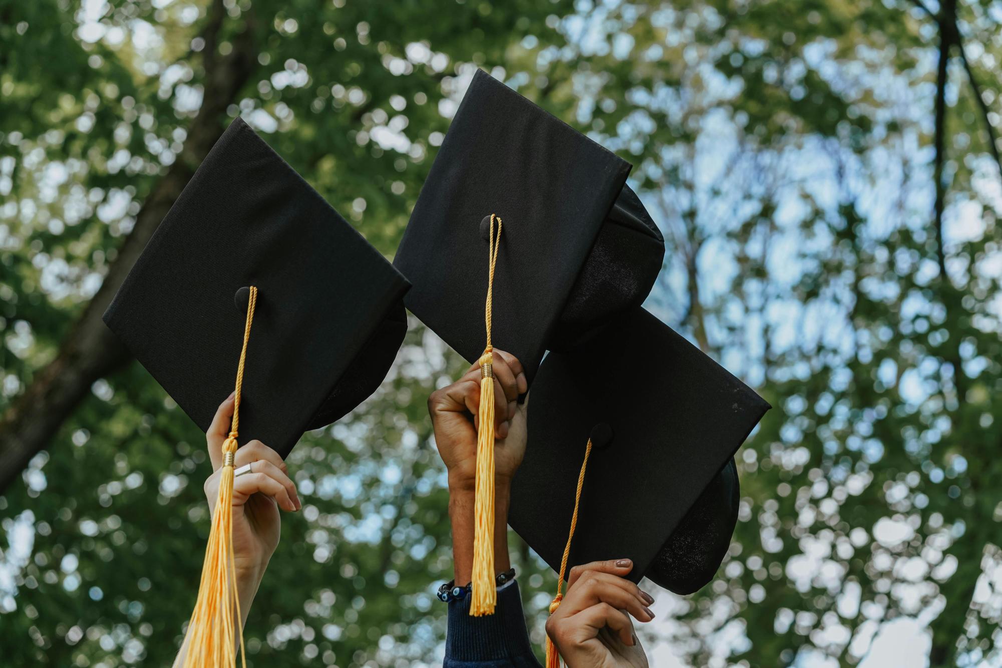 Graduates holding up their last moments of high school as they slowly make their way into adulthood.