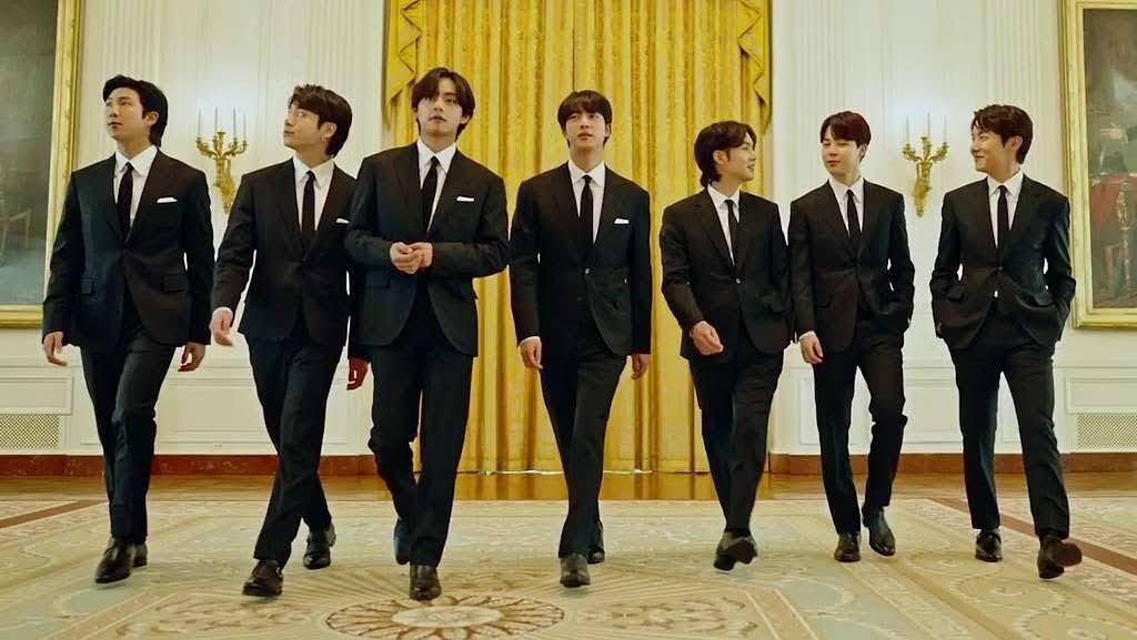 A past group photo of BTS before focusing on solo careers and service.